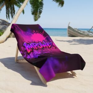 Empower Beach Towel Large, hanging over a lounge chair on a tropical beach