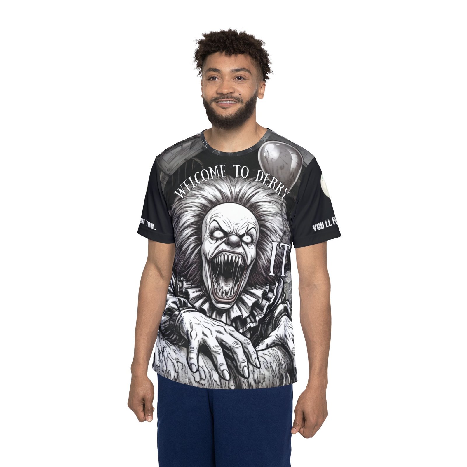 Front Design: A terrifying, stylized monochrome illustration of the ancient evil clawing its way forward, jaws wide in a razor-sharp grin. Arched above is the stark warning "Welcome to Derry", complete with a single floating balloon and a bold, classic "IT" graphic.